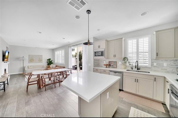 Dining room, Interior, Kitchen, Pendant Lights, Recessed Lighting, Stainless Steel Appliances, Wood Texture Flooring