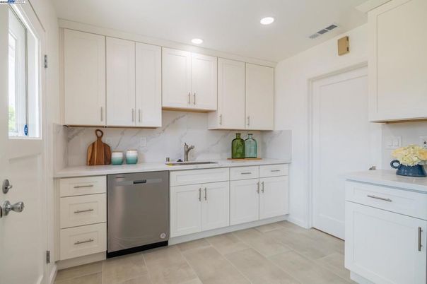 Interior, Kitchen, Marble Walls, Recessed Lighting, Stainless Steel Appliances