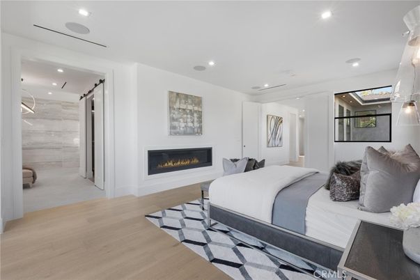 Bedroom, Fireplace, Interior, Pendant Lights, Recessed Lighting, Wood Texture Flooring