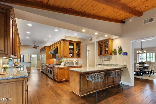 Chandelier, Dining room, Interior, Kitchen, Recessed Lighting, Stainless Steel Appliances, Wooden Beams, Wooden Ceilings, Wood Texture Flooring