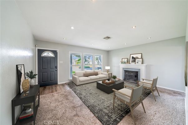 Dining room, Fireplace, Interior, Living room, Recessed Lighting, Wood Texture Flooring