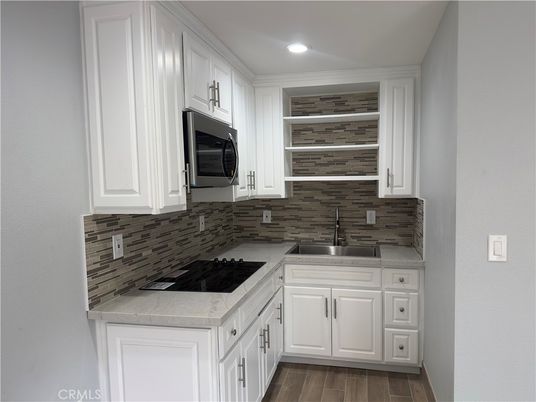 Interior, Kitchen, Recessed Lighting, Tile Countertops, Wood Texture Flooring
