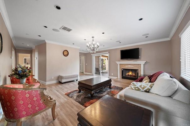 Chandelier, Fireplace, Interior, Living room, Recessed Lighting, Wood Texture Flooring