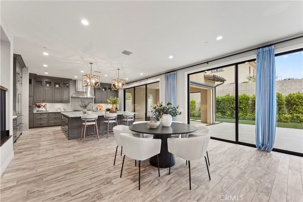 Chandelier, Dining room, Interior, Kitchen, Pendant Lights, Recessed Lighting, Stainless Steel Appliances, Wood Texture Flooring