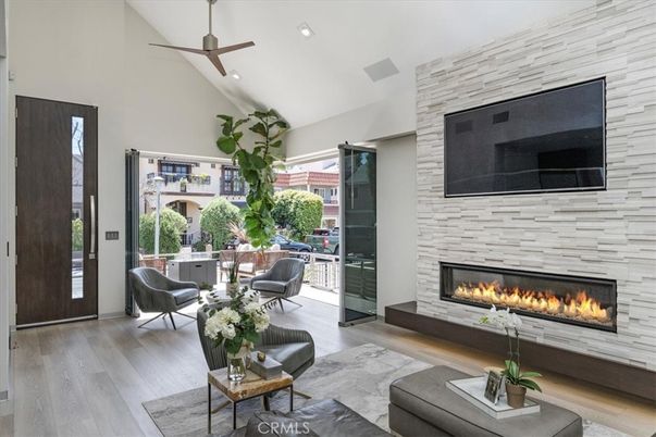 Fireplace, Interior, Living room, Recessed Lighting, Stone Walls, Wood Texture Flooring