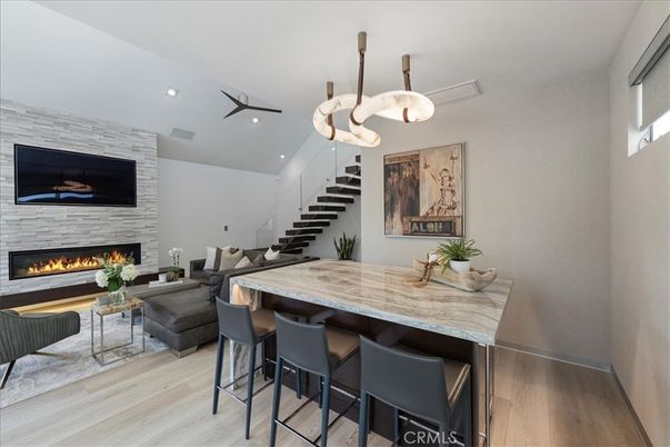 Fireplace, Interior, Living room, Recessed Lighting, Stone Walls, Wood Texture Flooring