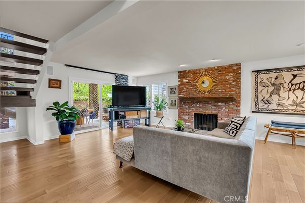 Fireplace, Interior, Living room, Recessed Lighting, Stone Walls, Wood Texture Flooring