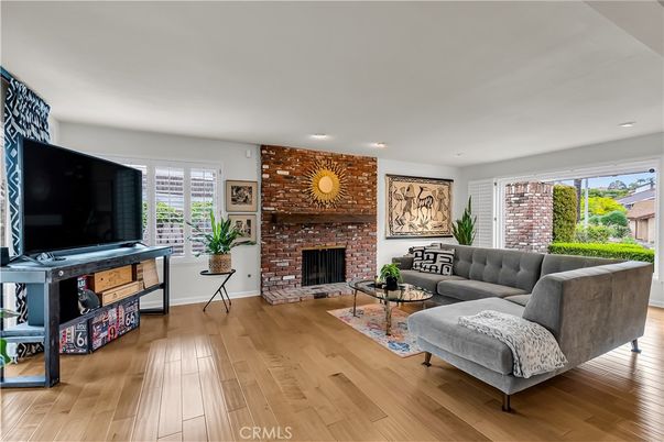 Fireplace, Interior, Living room, Recessed Lighting, Stone Walls, Wood Texture Flooring
