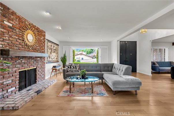 Fireplace, Interior, Living room, Recessed Lighting, Stone Walls, Wood Texture Flooring