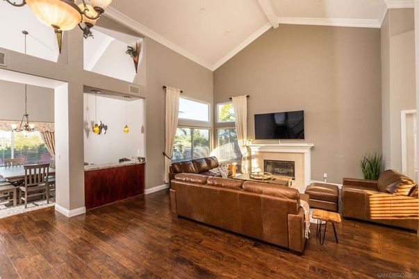 Chandelier, Dining room, Fireplace, Interior, Living room, Pendant Lights, Wood Texture Flooring
