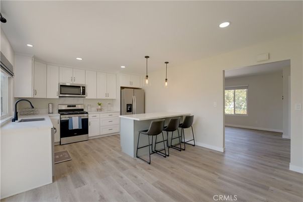 Interior, Kitchen, Pendant Lights, Recessed Lighting, Stainless Steel Appliances, Wood Texture Flooring