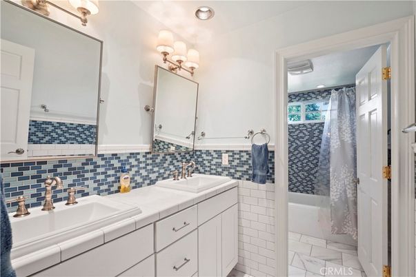 Bathroom, Dual Sink Vanities, Interior, Marble, Recessed Lighting, Tile Countertops