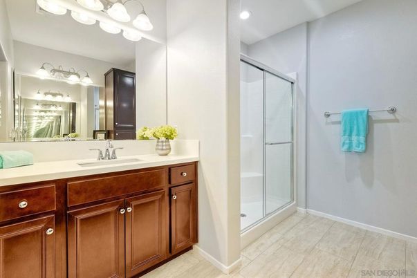 Bathroom, Dual Sink Vanities, Glass Shower, Interior, Recessed Lighting, Wood Texture Flooring
