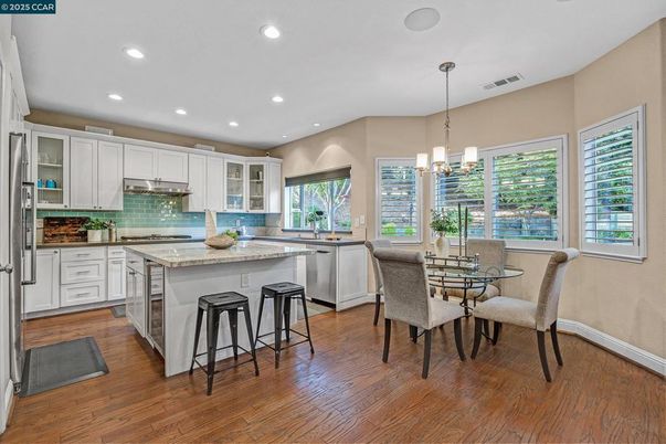 Dining room, Interior, Kitchen, Pendant Lights, Recessed Lighting, Stainless Steel Appliances, Wood Texture Flooring