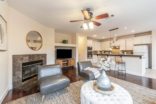 Fireplace, Interior, Kitchen, Recessed Lighting, Stainless Steel Appliances, Wood Texture Flooring