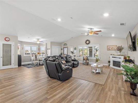 Dining room, Fireplace, Interior, Living room, Recessed Lighting, Wood Texture Flooring