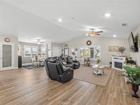 Dining room, Fireplace, Interior, Living room, Recessed Lighting, Wood Texture Flooring