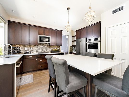 Chandelier, Interior, Kitchen, Pendant Lights, Recessed Lighting, Stainless Steel Appliances, Wood Texture Flooring