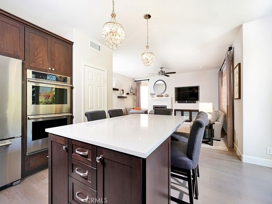 Chandelier, Dining room, Interior, Kitchen, Pendant Lights, Recessed Lighting, Stainless Steel Appliances, Wood Texture Flooring