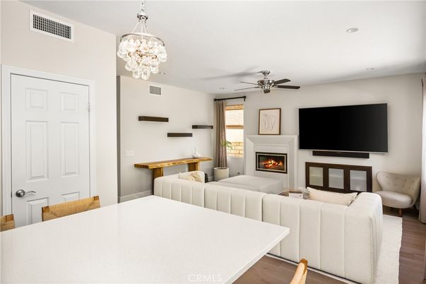 Chandelier, Fireplace, Interior, Living room, Pendant Lights, Recessed Lighting, Wood Texture Flooring