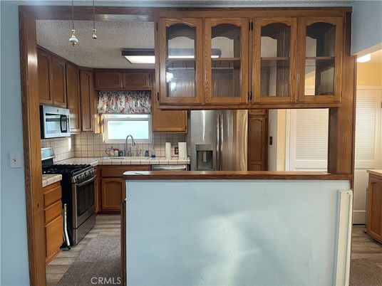 Interior, Kitchen, Pendant Lights, Tile Countertops, Wood Texture Flooring