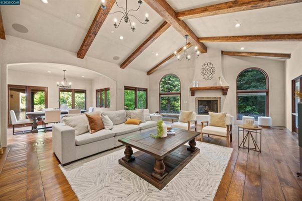 Chandelier, Dining room, Fireplace, Interior, Living room, Recessed Lighting, Wooden Beams, Wood Texture Flooring