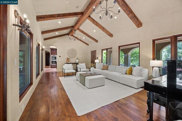 Chandelier, Interior, Living room, Piano, Recessed Lighting, Wooden Beams, Wood Texture Flooring