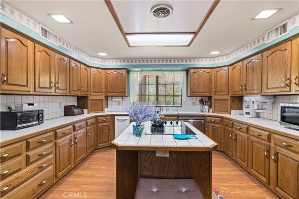 Interior, Kitchen, Recessed Lighting, Tile Countertops, Wood Texture Flooring