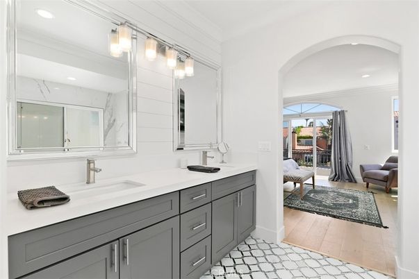Bathroom, Dual Sink Vanities, Interior, Marble Walls, Recessed Lighting, Wood Texture Flooring