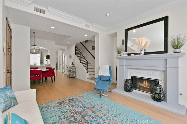 Dining room, Fireplace, Interior, Living room, Pendant Lights, Recessed Lighting, Wood Texture Flooring