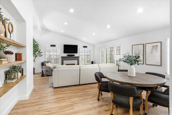 Dining room, Fireplace, Interior, Living room, Recessed Lighting, Wood Texture Flooring