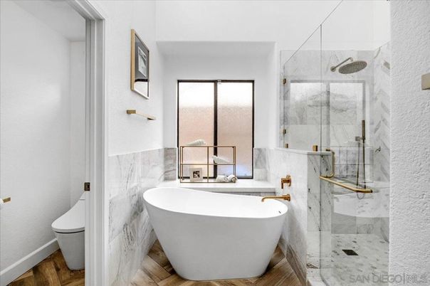 Bathroom, Free Standing Baths, Glass Shower, Interior, Marble Walls, Wood Texture Flooring
