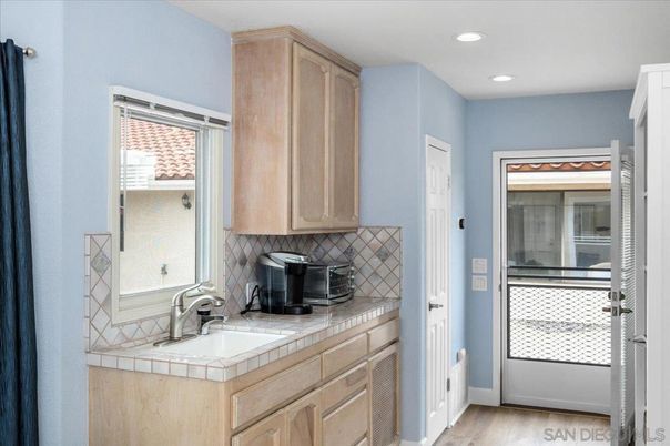 Interior, Kitchen, Recessed Lighting, Tile Countertops, Wood Texture Flooring