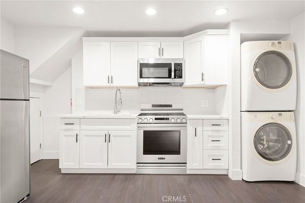 Interior, Kitchen, Recessed Lighting, Utility Closets, Washer, Wood Texture Flooring
