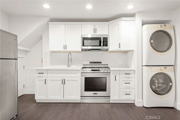 Interior, Kitchen, Recessed Lighting, Utility Closets, Washer, Wood Texture Flooring
