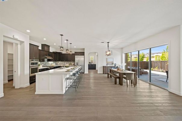 Chandelier, Dining room, Interior, Kitchen, Pendant Lights, Recessed Lighting, Stainless Steel Appliances, Wood Texture Flooring