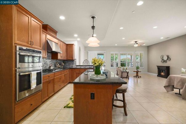 Dining room, Fireplace, Interior, Kitchen, Pendant Lights, Recessed Lighting, Stainless Steel Appliances