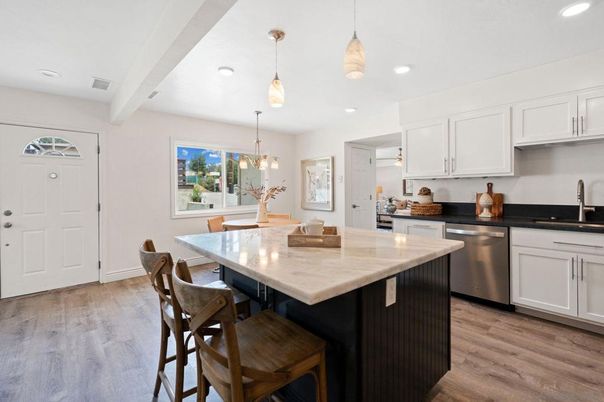 Dining room, Interior, Kitchen, Pendant Lights, Recessed Lighting, Stainless Steel Appliances, Wood Texture Flooring