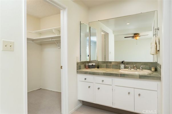 Bathroom, Dual Sink Vanities, Interior, Recessed Lighting, Tile Countertops