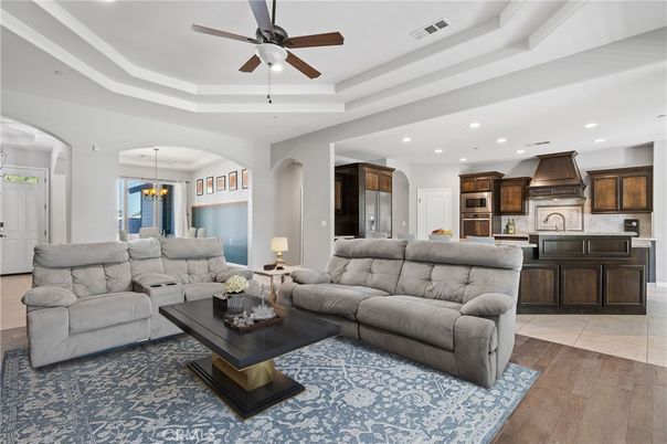 Chandelier, Dining room, Interior, Kitchen, Living room, Pendant Lights, Recessed Lighting, Stainless Steel Appliances, Wood Texture Flooring