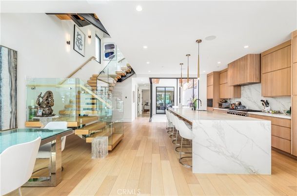 Interior, Kitchen, Marble Walls, Pendant Lights, Recessed Lighting, Stainless Steel Appliances, Wood Texture Flooring