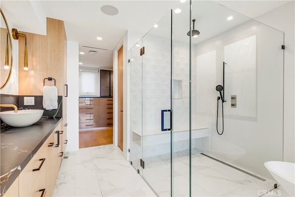 Bathroom, Dual Sink Vanities, Glass Shower, Interior, Marble, Recessed Lighting, Wood Texture Flooring
