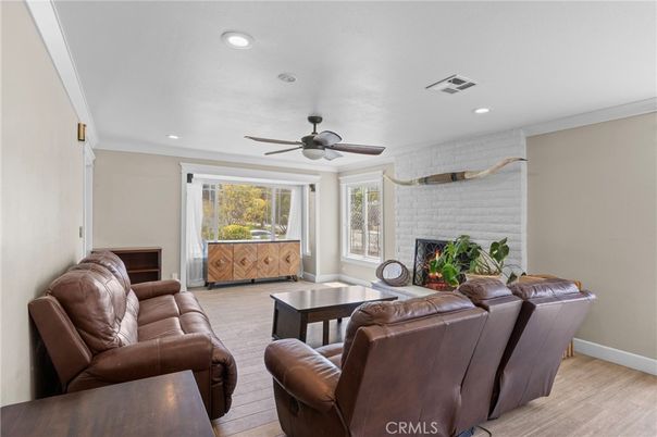 Fireplace, Interior, Living room, Recessed Lighting, Stone Walls, Wood Texture Flooring