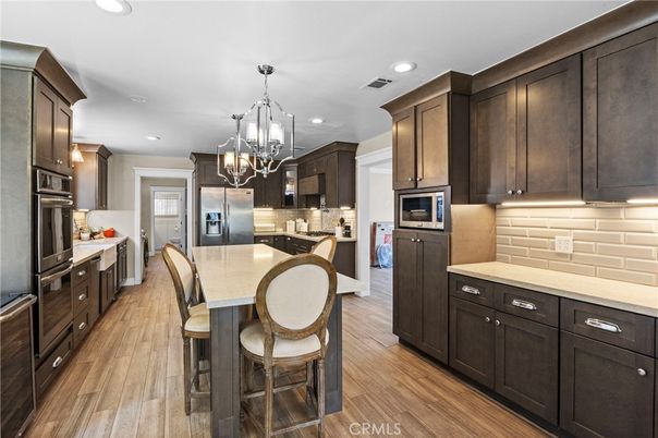 Chandelier, Interior, Kitchen, Pendant Lights, Recessed Lighting, Stainless Steel Appliances, Wood Texture Flooring