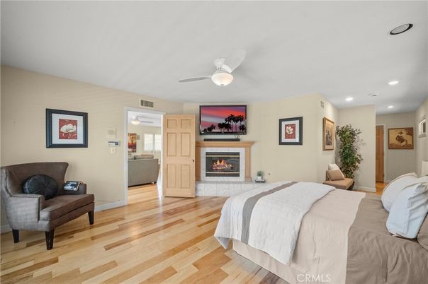 Bedroom, Fireplace, Interior, Recessed Lighting, Wood Texture Flooring