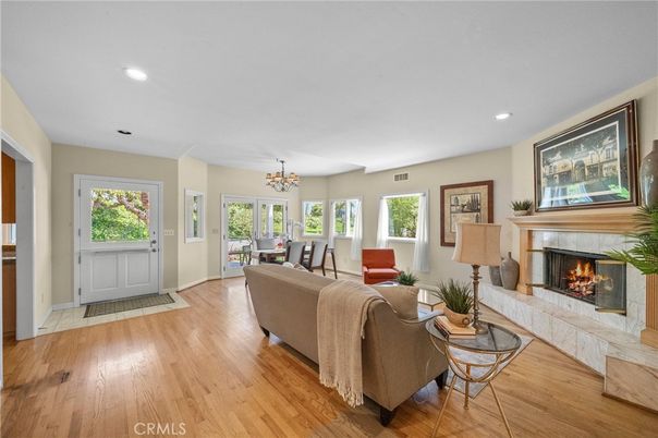 Chandelier, Dining room, Fireplace, Interior, Living room, Recessed Lighting, Wood Texture Flooring