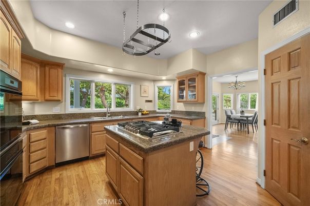 Dining room, Interior, Kitchen, Pendant Lights, Recessed Lighting, Stainless Steel Appliances, Wood Texture Flooring
