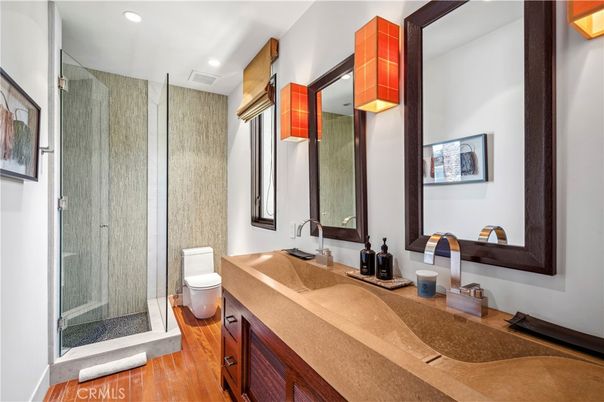 Bathroom, Dual Sink Vanities, Glass Shower, Interior, Recessed Lighting, Wood Texture Flooring