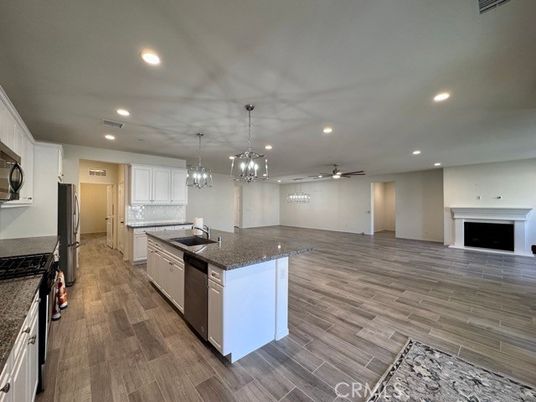 Fireplace, Interior, Kitchen, Pendant Lights, Recessed Lighting, Wood Texture Flooring