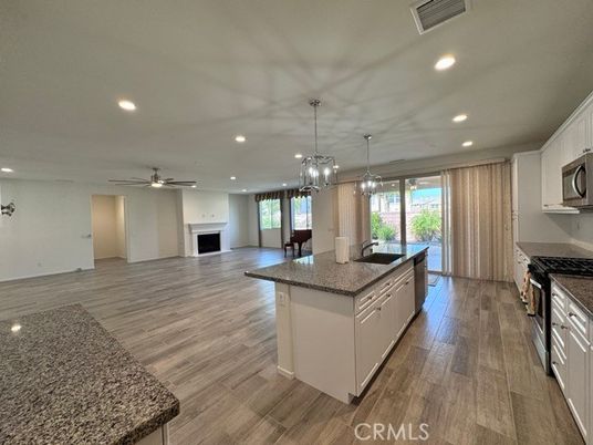 Chandelier, Fireplace, Interior, Kitchen, Pendant Lights, Recessed Lighting, Wood Texture Flooring
